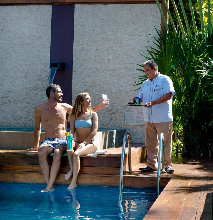 Magic Blue Spa Boutique Hotel Adults Only Playa del Carmen Exterior photo A butler serving drinks at a resort